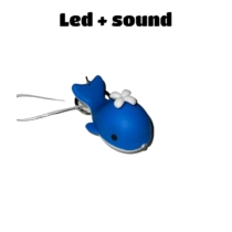 LED-es kulcstartó hanggal Bálna